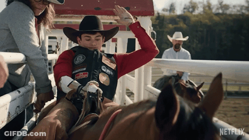 Man In Cowboy Hat Riding Horse Netflix GIF