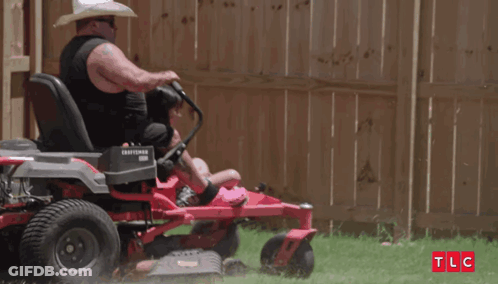 Man In Cowboy Hat Riding Lawn Mower With Daughter GIF
