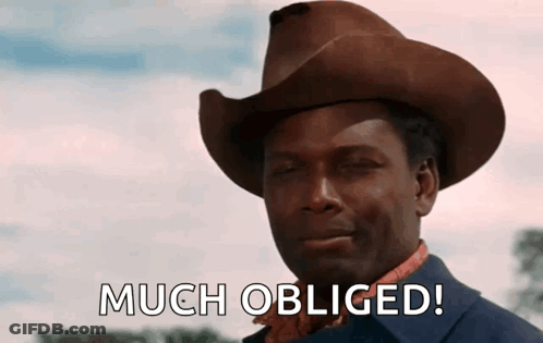 Man In Cowboy Hat Saying Much Obliged GIF