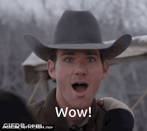 Man In Cowboy Hat Says Wow With Mouth Open GIF