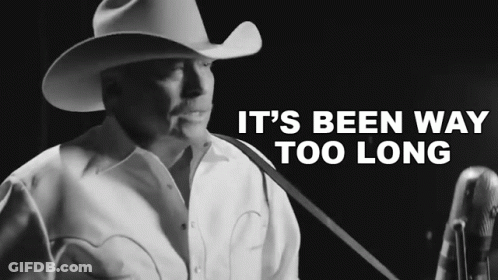Man In Cowboy Hat Singing Into Microphone It's Been Way Too Long GIF