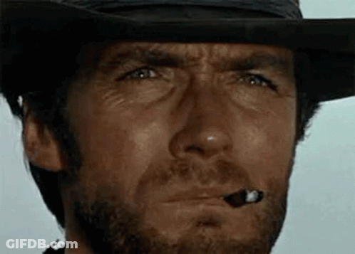 Man In Cowboy Hat Smoking Cigar GIF