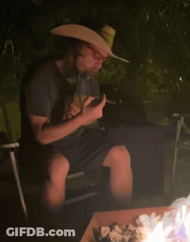 Man In Cowboy Hat Smoking Cigar GIF