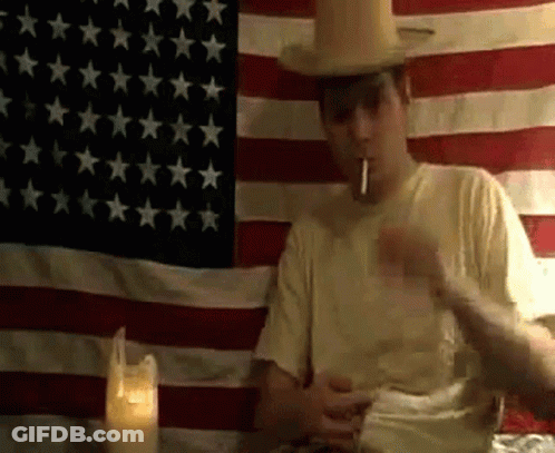 Man In Cowboy Hat Smoking Cigarette GIF