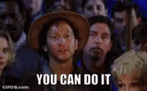 Man In Cowboy Hat Standing Before Crowd GIF