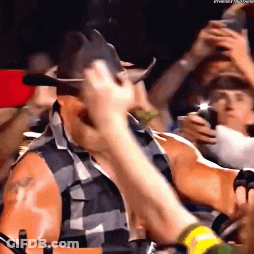 Man In Cowboy Hat Standing In Crowd GIF
