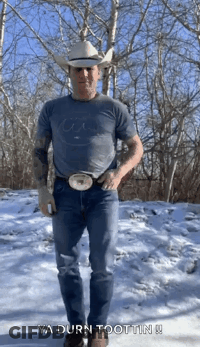 Man In Cowboy Hat Standing In Snow GIF