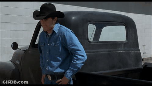 Man In Cowboy Hat Standing Next To Truck GIF