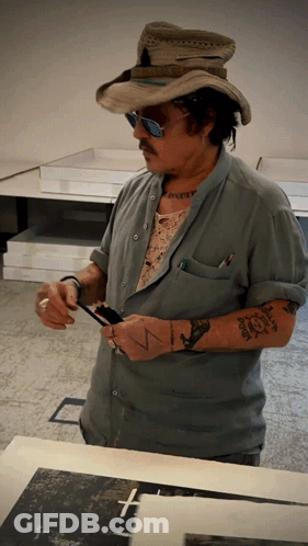 Man In Cowboy Hat Sunglasses With Tattoo Saying N GIF