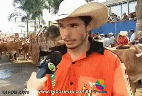 Man In Cowboy Hat Talking Into Microphone Www.tvgoiania.com.br GIF