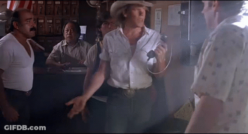 Man In Cowboy Hat Talking On Microphone GIF