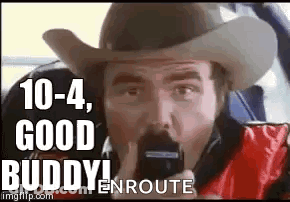 Man In Cowboy Hat Talking On Phone GIF