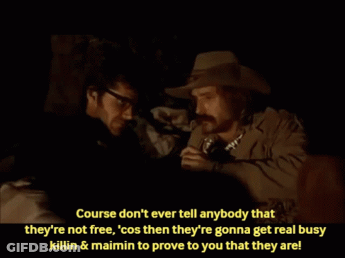 Man In Cowboy Hat Talking To Man In Glasses GIF
