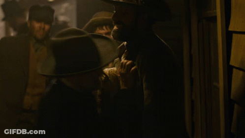 Man In Cowboy Hat Talking To Suit GIF