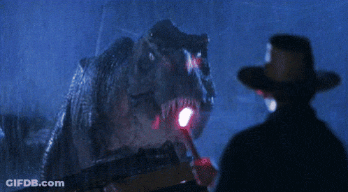 Man In Cowboy Hat With Dinosaur GIF
