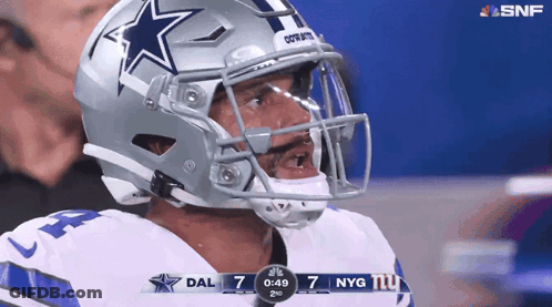 Man In Cowboys Helmet Looking At Scoreboard GIF