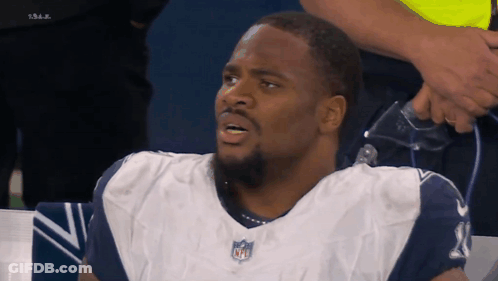 Man In Cowboys Jersey With NFL Logo GIF