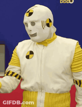Man In Crash Test Dummy Costume In Front Of Bbbo Sign GIF