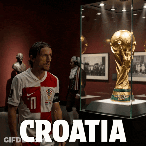 Man In Croatia Jersey Looks At Trophy GIF
