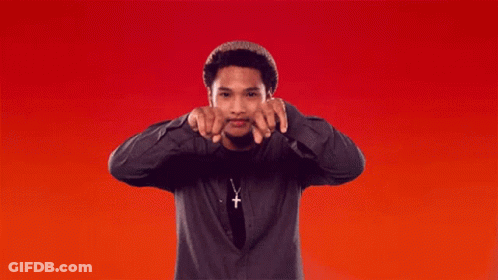 Man In Cross Necklace Pointing GIF