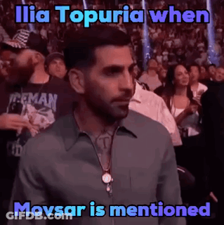 Man In Crowd Watching Boxing Match Saying Ilia Topuria When Movsar Is Mentioned GIF
