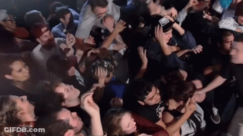 Man In Crowd Wearing I Love You Hat GIF