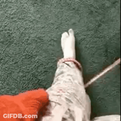 Man In Crowd With Hands In Pockets GIF