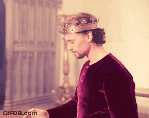 Man In Crown And Red Shirt Standing GIF