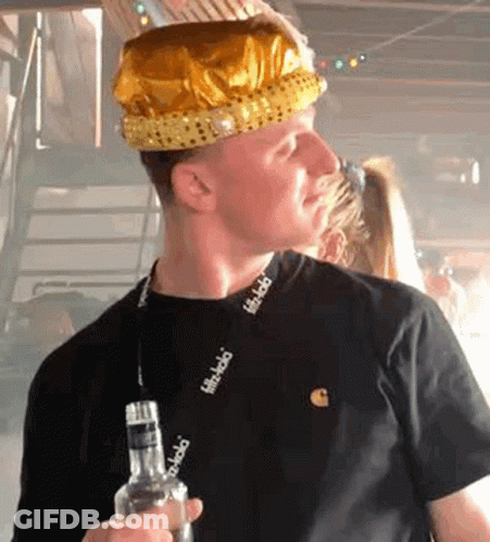 Man In Crown Holding Liquor Bottle GIF