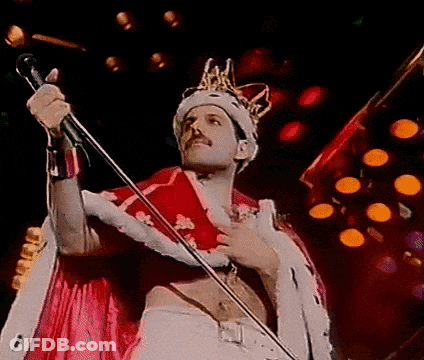 Man In Crown Singing Into Microphone GIF