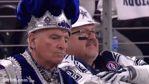 Man In Crown Sitting Next To Man In Cowboy Uniform GIF