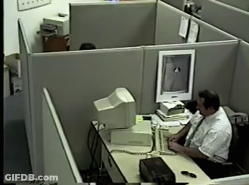 Man In Cubicle With Computer Monitor GIF