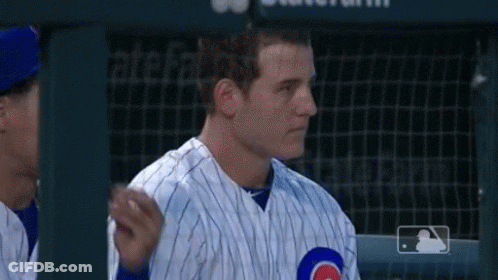 Man In Cubs Uniform Standing In Dugout GIF