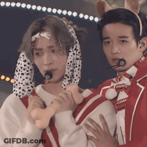Man In Dalmatian Costume Holding Another Man's Hand GIF