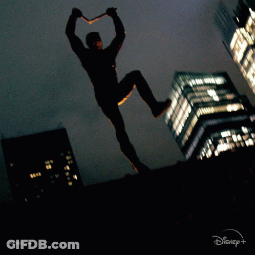 Man In Daredevil Costume Jumping GIF
