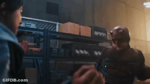 Man In Daredevil Costume Talking To Woman GIF