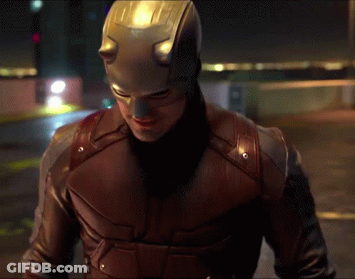 Man In Daredevil Costume Walking Night Street GIF