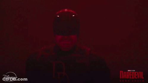 Man In Daredevil Suit Holding Sword GIF