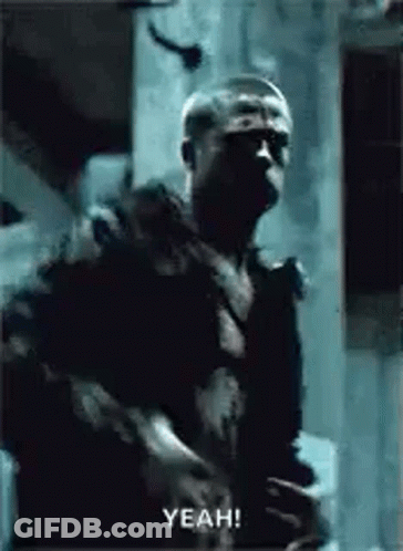 Man In Dark Room Holding Gun Saying Yeah GIF