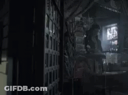 Man In Dark Room Holding Knife And Sword GIF