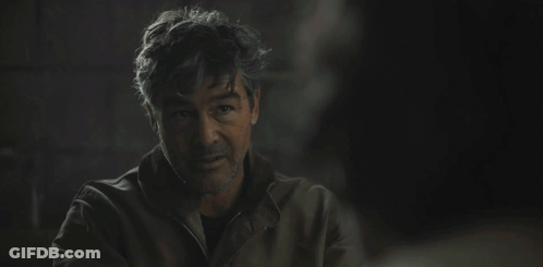 Man In Dark Room Saying Holy Shit You Are An Alien GIF