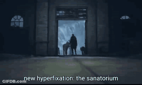 Man In Dark Room Saying New Hyperfixation The Sanatorium GIF