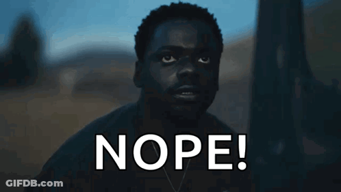 Man In Dark Room Saying Nope GIF