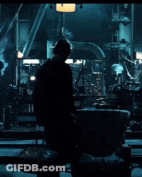 Man In Dark Room With Chain GIF