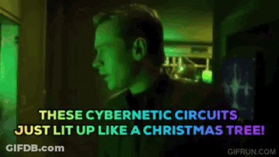 Man In Dark Room With Christmas Tree Says These Cybernetic Circuits Just Lit Up GIF
