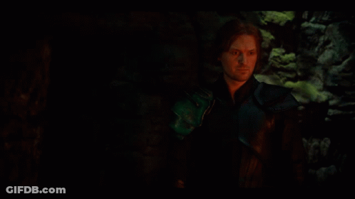 Man In Dark Room With Green Glove GIF