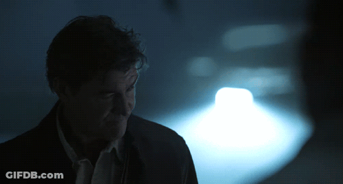 Man In Dark Room With Light On Face GIF