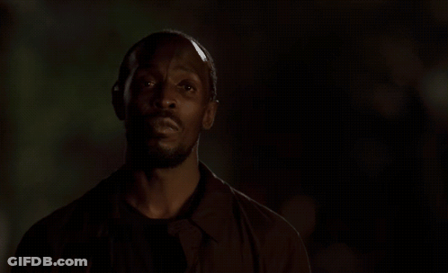 Man In Dark Room With Omar Listenin GIF