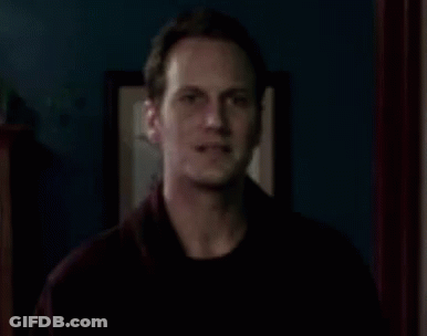 Man In Dark Room With Picture On Wall GIF