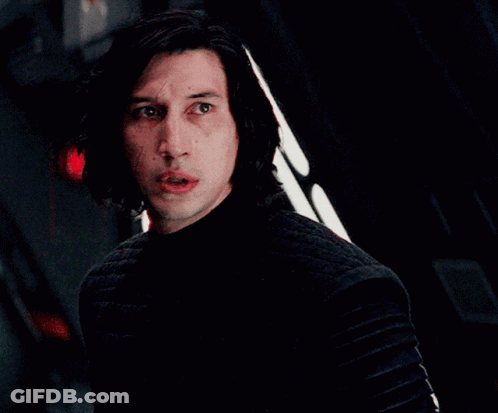 Man In Dark Room With Red Light Behind GIF